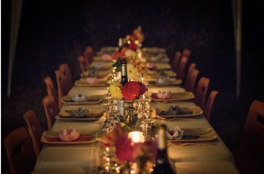 Elegantly set candlelit dinner table — Cater2uSF private event